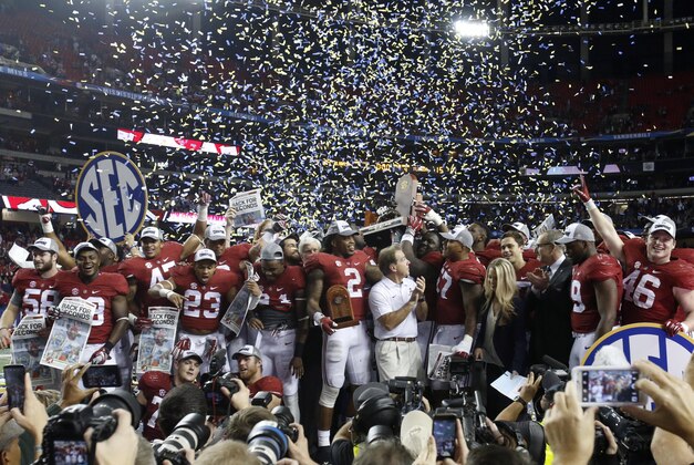 Dec 5, 2015; Atlanta, GA, USA; Alabama Crimson Tide head coach Nick Saban celebrates with his team after winning the 2015 SEC Championship Game against the Florida Gators at the Georgia Dome. Alabama won 29-15. Mandatory Credit: Jason Getz-USA TODAY Sports