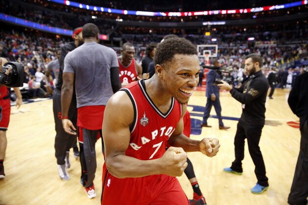 Toronto Raptors guard Kyle Lowry (7) celebrates after an NBA basketball game against the Washington Wizards, Saturday, Nov. 28, 2015, in Washington. Cory Joseph hit a three-point shot as time expired. The Raptors won 84-82. (AP Photo/Alex Brandon)