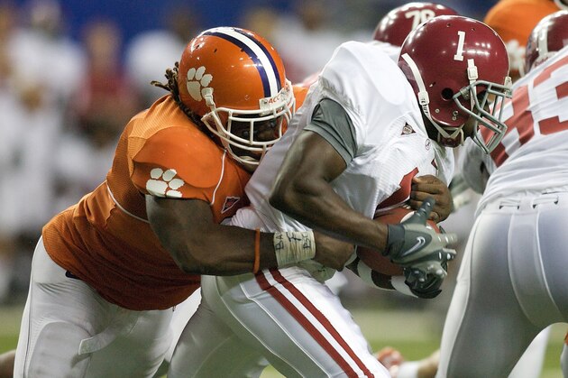 ATLANTA - AUGUST 30: Brandon Maye #20 of the Clemson Tigers works to bring down B.J. Scott #1 of the Alabama Crimson Tide at the Georgia Dome on August 30, 2008 in Atlanta, Georgia.  (Photo by Rex Brown/Getty Images)
