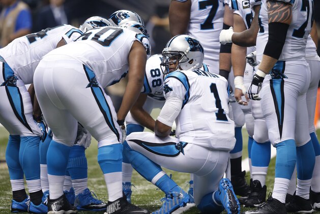 Carolina Panthers quarterback Cam Newton (1) calls a play in the huddle in the first half of an NFL football game against the New Orleans Saints in New Orleans, Sunday, Dec. 6, 2015. (AP Photo/Bill Feig)