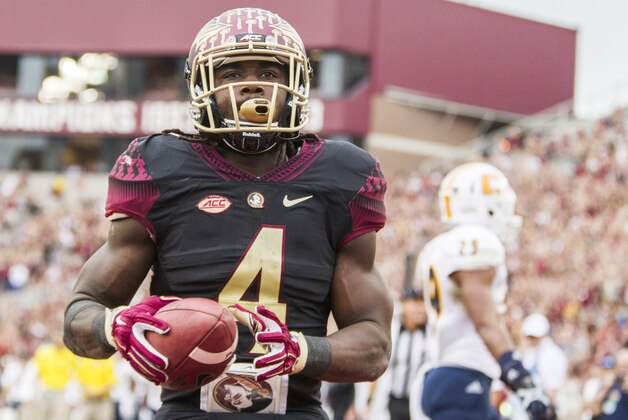 Florida State running back Dalvin Cook runs in for a touchdown in the first half of an NCAA college football game against Chattanooga in Tallahassee, Fla., Saturday, Nov. 21, 2015.  Florida State defeated Chattanooga 52-13.  (AP Photo/Mark Wallheiser)