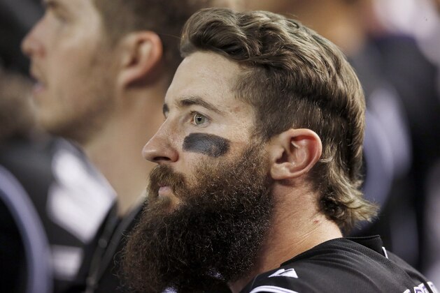Colorado Rockies' Charlie Blackmon watches the action on the field from the dugout during the ninth inning of a baseball game against the Arizona Diamondbacks Wednesday, Sept. 30, 2015, in Phoenix.  The Diamondbacks defeated the Rockies 3-1. (AP Photo/Ross D. Franklin)