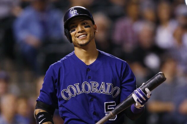 Colorado Rockies right fielder Carlos Gonzalez (5) bats against the Los Angeles Dodgers in the fourth inning of a baseball game Friday, Sept. 25, 2015, in Denver. (AP Photo/David Zalubowski)