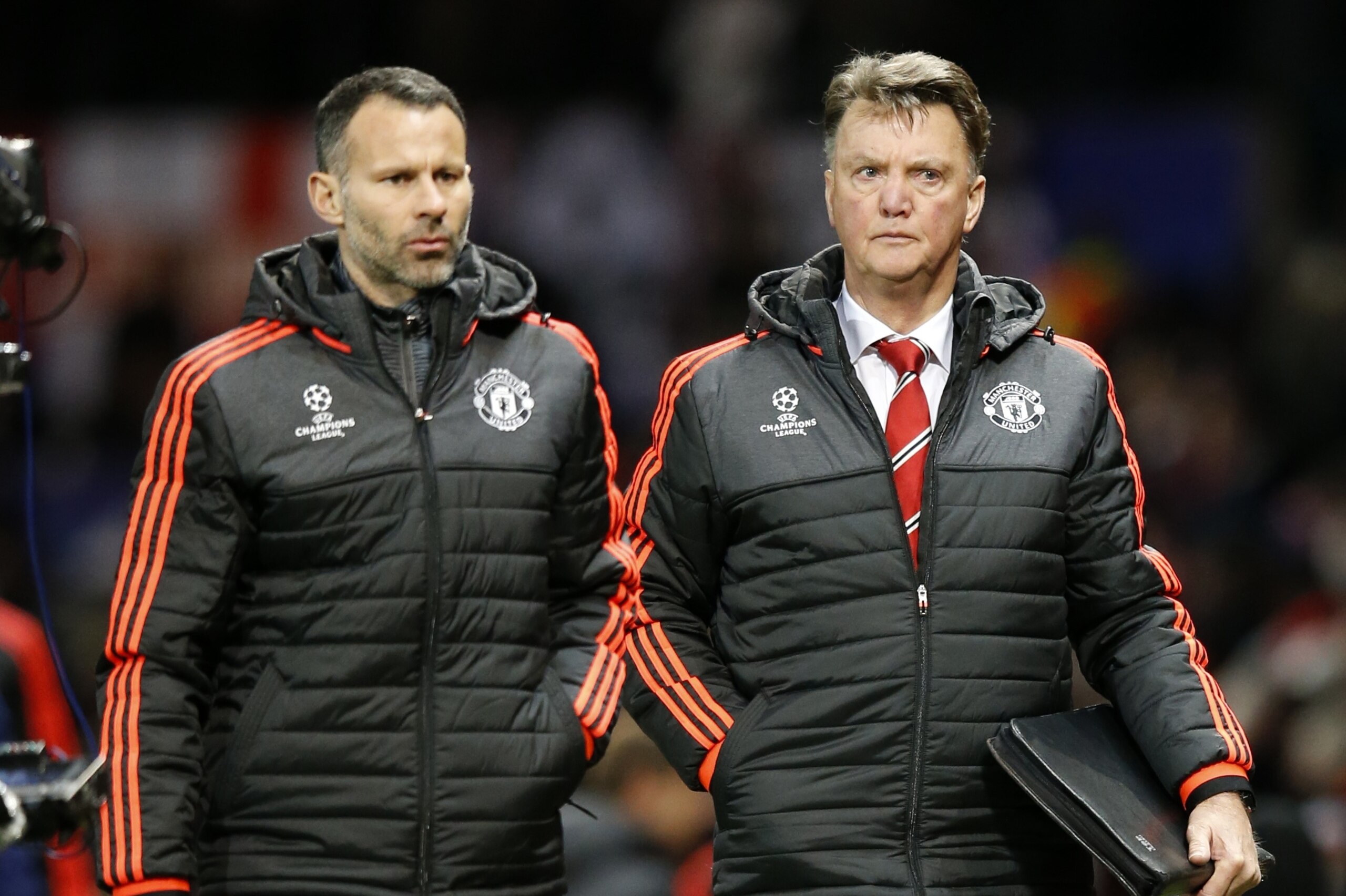 Manchester United's manager Louis van Gaal, right, and Ryan Giggs assistant manager leave the pitch after the Champions League group B soccer match between Manchester United and PSV Eindhoven at Old Trafford Stadium in Manchester, England, Wednesday, Nov. 25, 2015.The match ended 0-0. (AP Photo/Jon Super)