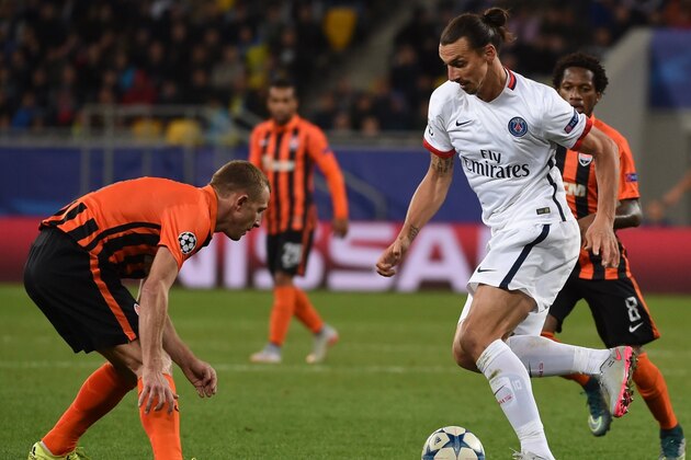 Shakhtar Donetsk's Ukrainian defender Vyacheslav Shevchuk (L) vies with Paris Saint-Germain's Swedish forward Zlatan Ibrahimovic during the UEFA Champions League group A football match between Shakhtar Donetsk and Paris Saint-Germain at the Arena Lviv, in the Ukrainian city of Lviv, on September 30, 2015. AFP PHOTO / PASCAL GUYOT        (Photo credit should read PASCAL GUYOT/AFP/Getty Images)