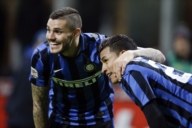 Inter Milan's Jeison Murillo, right, celebrates with his teammate Mauro Icardi  after scoring during a Serie A soccer match between Inter Milan and Frosinone at the San Siro stadium in Milan, Italy, Nov. 22, 2015. (AP Photo/Luca Bruno)
