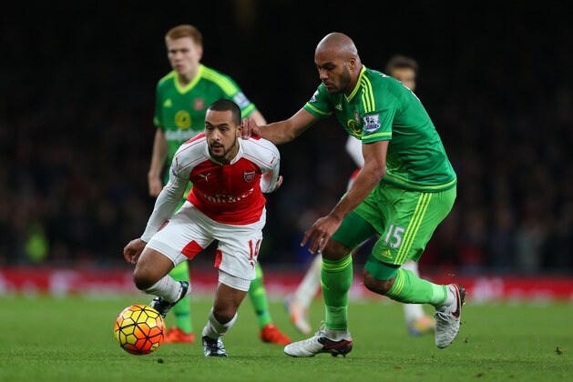 LONDON, ENGLAND - DECEMBER 05:  Theo Walcott of Arsenal and Younes Kaboul of Sunderland during the Barclays Premier League match between Arsenal and Sunderland at the Emirates Stadium on December 05, 2015 in London, England.  (Photo by Catherine Ivill - AMA/Getty Images)