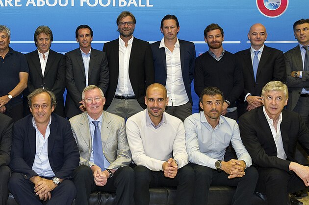 NYON, SWITZERLAND - SEPTEMBER 03:  UEFA Chief Refereeing Officer Pierluigi Collina, Paris St. Germain FC Coach Laurent Blanc, Manchester City FC Coach Manuel Pellegrini, Valencia CF Coach Nuno Espirito Santo, FC Schalke 04 Coach Jens Keller, FC Shakhtar Donetsk Coach Mircea Lucescu, SL Benfica Coach Jorge Jesus, Sevilla FC Coach Unai Emery, Borussia Dortmund Coach Juergen Klopp, Bayer 04 Leverkusen Coach Roger Schmidt, FC Zenit Coach Andre Villas-Boas, UEFA General Secretary Gianni Infantino, UEFA Chief Technical Officer Ioan Lupescu, UEFA Competition Director Giorgio Marchetti, Olympiacos Coach Miguel, SSC Napoli Coach Rafael Benitez, Real Madrid Coach Carlo Ancelotti, AC Milan Coach Filippo Inzaghi, UEFA President Michel Platini, Sir Alex Ferguson, FC Bayern Muenchen Coach Josep Guardiola, FC Barcelona Coach Luis Enrique and Arsenal FC Coach Arsene Wenger pose for a group photo prior to the UEFA Elite Coaches Forum at the UEFA headquarters, The House of European Football, on September 3, 2014 in Nyon, Switz