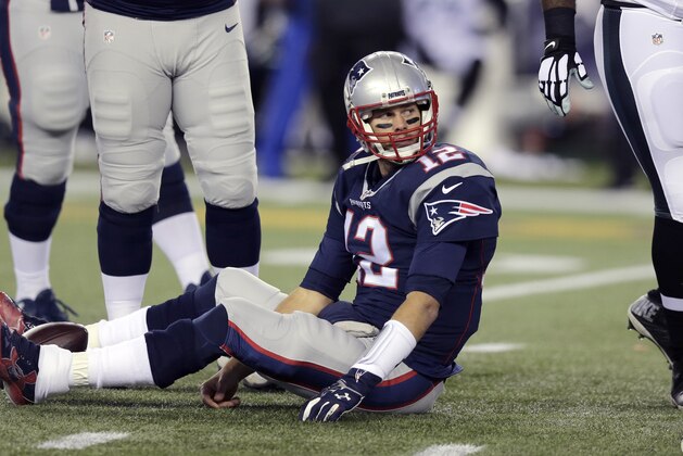 New England Patriots quarterback Tom Brady sits on the turf during the first half of an NFL football game against the Philadelphia Eagles, Sunday, Dec. 6, 2015, in Foxborough, Mass. (AP Photo/Charles Krupa)