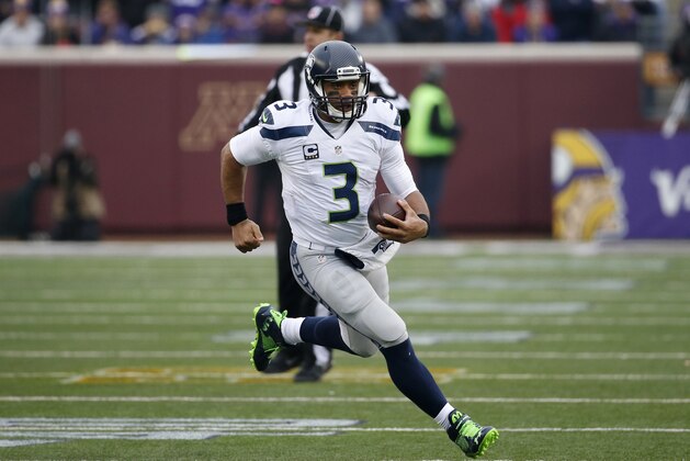 Seattle Seahawks quarterback Russell Wilson (3) looks to pass against the Minnesota Vikings in the second half of an NFL football game Sunday, Dec. 6, 2015 in Minneapolis. (AP Photo/Ann Heisenfelt)