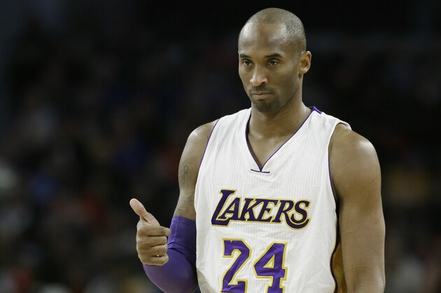 Los Angeles Lakers forward Kobe Bryant gives a thumbs up during the first half of an NBA basketball game against the Detroit Pistons, Sunday, Dec. 6, 2015, in Auburn Hills, Mich. (AP Photo/Carlos Osorio)