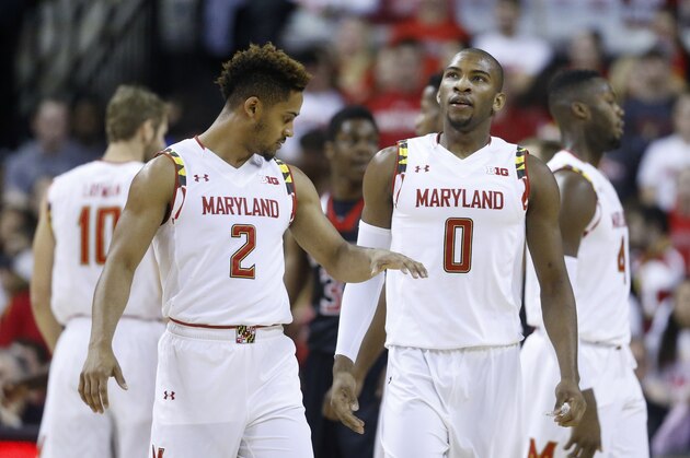Maryland guard Melo Trimble, left, high-fives teammate Rasheed Sulaimon in the first half of an NCAA college basketball game against St. Francis, Friday, Dec. 4, 2015, in College Park, Md. (AP Photo/Patrick Semansky)