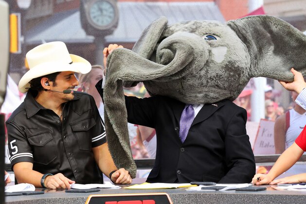 Sep 5, 2015; Fort Worth, TX, USA; Guest picker Brad Paisley and Lee Corso after Corso picked the head gear of