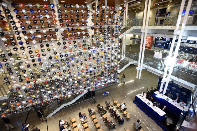 A wall of college football helmets is on exhibit during a press conference introducing the 2013 College Football Hall of Fame enshrinement class at the Hall's new facility Tuesday, Oct. 7, 2014, in Atlanta. The class of 2013 includes inductees Ted Brown, RB, North Carolina State, Tedy Bruschi, DE, Arizona; Ron Dayne, RB, Wisconsin; Tommie Frazier, QB, Nebraska; Jerry Gray, DB, Texas; Steve Meilinger, E, Kentucky; Orlando Pace, OT, Ohio State; Rod Shoate, LB, Oklahoma; Percy Snow, LB, Michigan State; Vinny Testaverde, QB, Miami; Don Trull, QB, Baylor; Danny Wuerffel, QB, Florida; Wayne Hardin, head coach, Navy and Temple and Bill McCartney, head coach, Colorado. (AP Photo/David Tulis) A wall of college football helmets is on exhibit during a press conference introducing the 2013 College Football Hall of Fame enshrinement class at the Hall's new facility Tuesday, Oct. 7, 2014, in Atlanta. The class of 2013 includes inductees Ted Brown, RB, North Carolina State, Tedy Bruschi, DE, Arizona; Ron Dayne, RB, Wisconsin; Tommie Frazier, QB, Nebraska; Jerry Gray, DB, Texas; Steve Meilinger, E, Kentucky; Orlando Pace, OT, Ohio State; Rod Shoate, LB, Oklahoma; Percy Snow, LB, Michigan State; Vinny Testaverde, QB, Miami; Don Trull, QB, Baylor; Danny Wuerffel, QB, Florida; Wayne Hardin, head coach, Navy and Temple and Bill McCartney, head coach, Colorado. (AP Photo/David Tulis)
