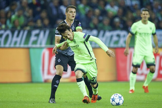 (L-R) Granit Xhaka of Borussia Monchengladbach, David Silva of Manchester City during the UEFA Champions League match between Borussia Monchengladbach and Manchester City on September 30, 2015 at the Borussia-Park stadium in Monchengladbach , Germany.(Photo by VI Images via Getty Images)