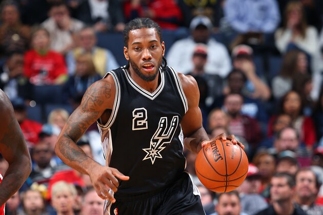 MEMPHIS, TN - DECEMBER 3: Kawhi Leonard #2 of the San Antonio Spurs handles the ball during the game against the Memphis Grizzlies on December 3, 2015 at FedExForum in Memphis, Tennessee. NOTE TO USER: User expressly acknowledges and agrees that, by downloading and or using this photograph, User is consenting to the terms and conditions of the Getty Images License Agreement. Mandatory Copyright Notice: Copyright 2015 NBAE (Photo by Joe Murphy/NBAE via Getty Images)