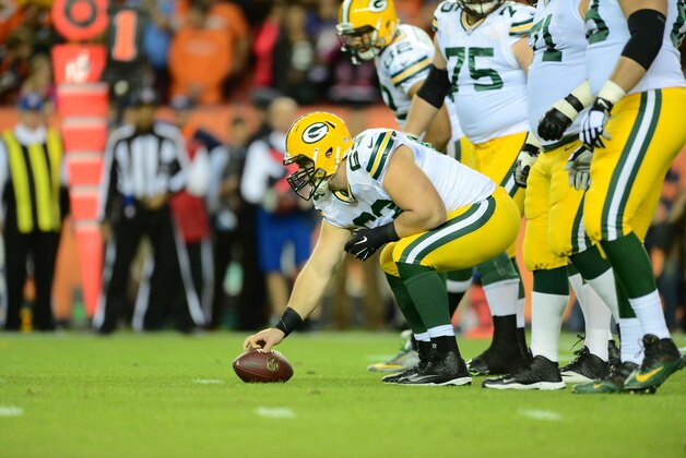 Nov 1, 2015; Denver, CO, USA; Green Bay Packers center Corey Linsley (63) at the line of scrimmage in the first quarter against the Denver Broncos at Sports Authority Field at Mile High. Mandatory Credit: Ron Chenoy-USA TODAY Sports