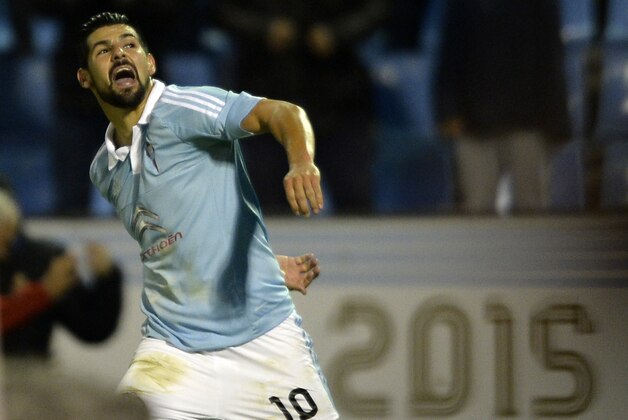 Celta Vigo's forward Nolito celebrates after scoring a goal during the Spanish league football match RC Celta de Vigo vs Real Sporting de Gijon at the Balaidos stadium in Vigo on November 28, 2015.   Celta won the match 2-1. AFP PHOTO/ MIGUEL RIOPA / AFP / MIGUEL RIOPA        (Photo credit should read MIGUEL RIOPA/AFP/Getty Images)