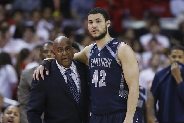 Georgetown head coach John Thompson III, left, speaks with center Bradley Hayes in the second half of an NCAA college basketball game against Maryland, Tuesday, Nov. 17, 2015, in College Park, Md. (AP Photo/Patrick Semansky)