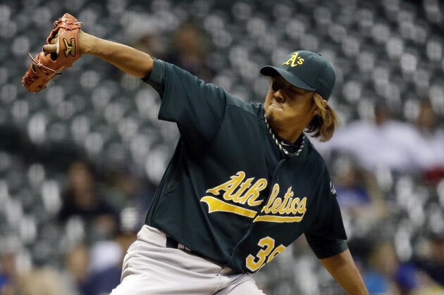 Oakland Athletics relief pitcher Hideki Okajima throws during the eighth inning of a baseball game against the Milwaukee Brewers Monday, June 3, 2013, in Milwaukee. (AP Photo/Morry Gash)