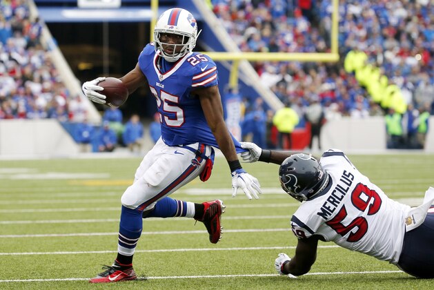 Buffalo Bills running back LeSean McCoy (25) avoids a tackle by Houston Texans outside linebacker Whitney Mercilus (59) during the first half of an NFL football game, Sunday, Dec. 6, 2015, in Orchard Park, N.Y. (AP Photo/Bill Wippert)