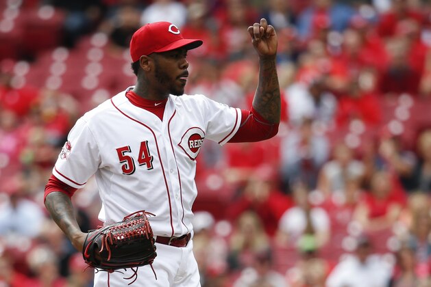 Cincinnati Reds relief pitcher Aroldis Chapman reacts after closing the ninth inning of a resumed baseball game against the St. Louis Cardinals, Saturday, Sept. 12, 2015, in Cincinnati. The game was resumed in the top of the eighth inning after it was suspended Sept. 11 due to rain. The Reds won 4-2. (AP Photo/John Minchillo)
