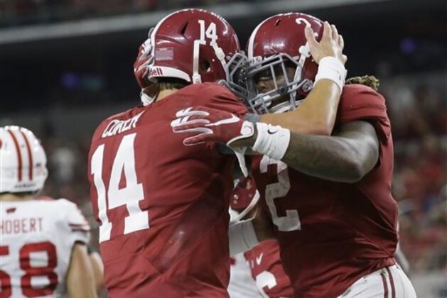 FILE - In this Sept. 4, 2015, file photo, Alabama running back Derrick Henry (2) celebrates rushing for a touchdown with quarterback Jake Coker (14) during the second half of an NCAA college football game against Wisconsin in Arlington, Texas. (AP Photo/LM Otero, File)