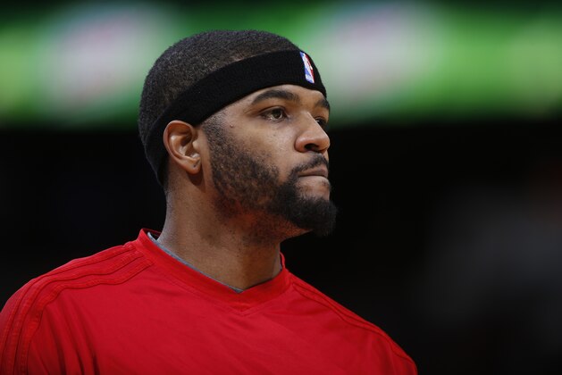 Los Angeles Clippers forward Josh Smith (5) warms up before the first half of an NBA basketball game Tuesday, Nov. 24, 2015, in Denver. (AP Photo/David Zalubowski)