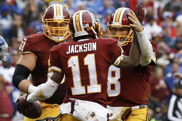 Washington Redskins wide receiver DeSean Jackson (11) celebrates his touchdown with quarterback Kirk Cousins (8) during the first half of an NFL football game against the New York Giants in Landover, Md., Sunday, Nov. 29, 2015. (AP Photo/Patrick Semansky)