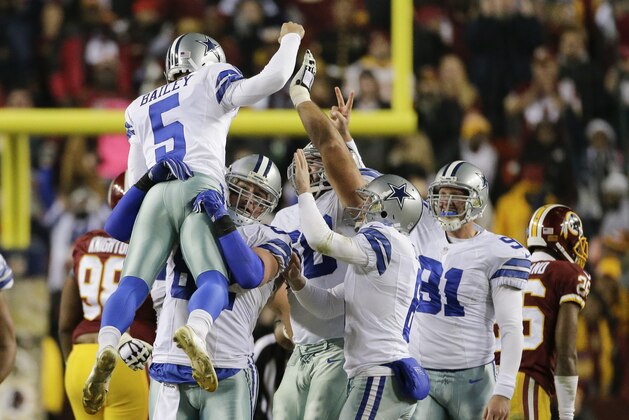 Dallas Cowboys kicker Dan Bailey (5) celebrates his game winning field goal with his teammates during the second half of an NFL football game against the Washington Redskins in Landover, Md., Monday, Dec. 7, 2015. The Dallas Cowboys defeated the Washington Redskins 19-16. (AP Photo/Mark Tenally)