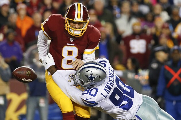 Dallas Cowboys defensive end Demarcus Lawrence (90) sacks Washington Redskins quarterback Kirk Cousins (8) during the first half of an NFL football game in Landover, Md., Monday, Dec. 7, 2015. (AP Photo/Alex Brandon)