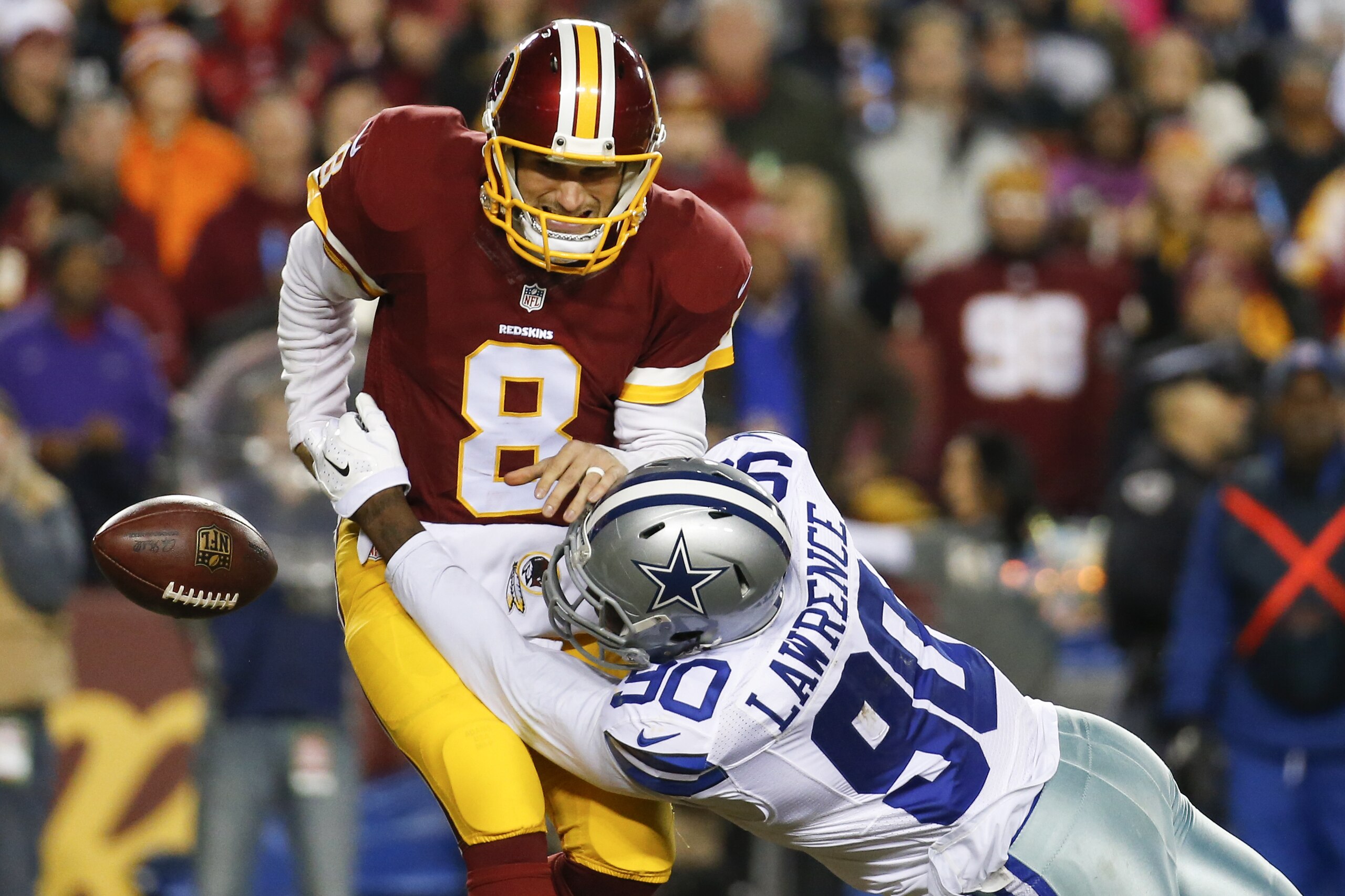 Dallas Cowboys defensive end Demarcus Lawrence (90) sacks Washington Redskins quarterback Kirk Cousins (8) during the first half of an NFL football game in Landover, Md., Monday, Dec. 7, 2015. (AP Photo/Alex Brandon)