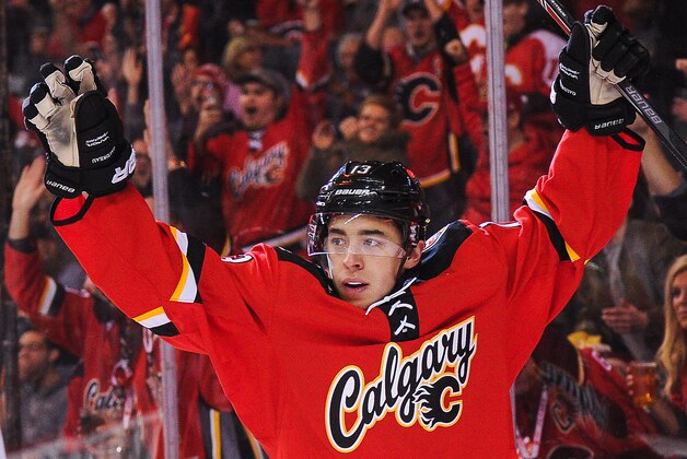 CALGARY, AB - DECEMBER 4: Johnny Gaudreau #13 of the Calgary Flames celebrates after scoring against the Boston Bruins during an NHL game at Scotiabank Saddledome on December 4, 2015 in Calgary, Alberta, Canada. (Photo by Derek Leung/Getty Images)