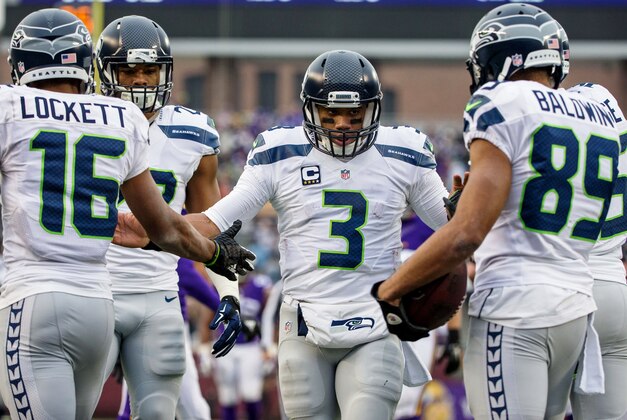 Dec 6, 2015; Minneapolis, MN, USA; Seattle Seahawks quarterback Russell Wilson (3) celebrates with teammates during the third quarter against the Minnesota Vikings at TCF Bank Stadium. The Seahawks defeated the Vikings 38-7. Mandatory Credit: Brace Hemmelgarn-USA TODAY Sports