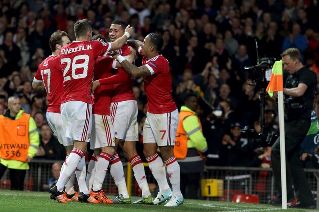MANCHESTER, ENGLAND - SEPTEMBER 30:  Chris Smalling of Manchester United celebrates with teammates after scoring a goal to make it 2-1 during the UEFA Champions League match between Manchester United and Wolfsburg at Old Trafford on September 30, 2015 in Manchester, United Kingdom.  (Photo by Matthew Ashton - AMA/Getty Images)