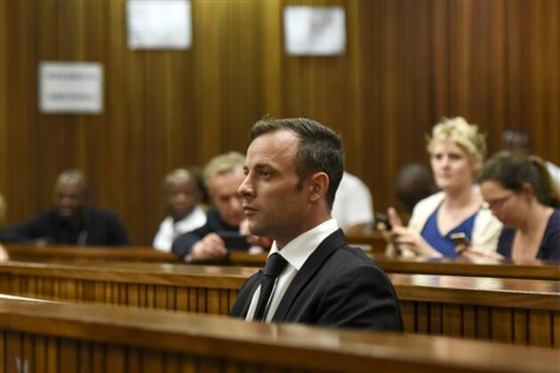 Oscar Pistorius sits in the dock at a courtroom of the North Gauteng High Court in Pretoria, South Africa, Tuesday Dec. 8, 2015. Pistorius arrived in the South African courtroom, where he is expected to apply for bail following his conviction for murdering girlfriend Reeva Steenkamp. (AP Photo/Herman Verwey, Pool)