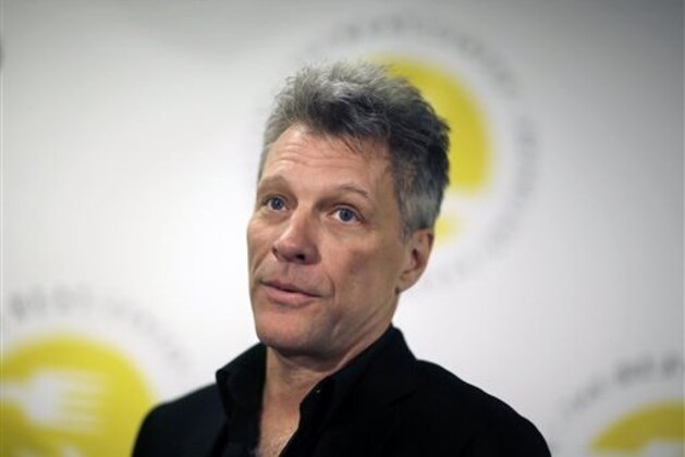 Jon Bon Jovi appears at a news conference where he announced his Jon Bon Jovi Soul Foundation's plans for the B.E.A.T. Center, Tuesday, April 14, 2015, in Toms River, N.J. The center is designed as a one-stop facility to help people get food stamps, health care, meals for at-risk children and seniors, and culinary-related job training. It will open later this year in Toms River. (AP Photo/Mel Evans)