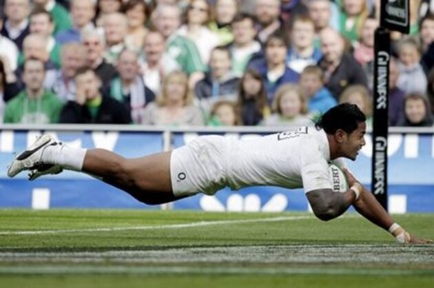 FILE - In this Aug. 27, 2011 file photo England's Manu Tuilagi scores a try against  Ireland  during their Rugby Union International game in Dublin, Ireland. Tuilagi is the youngest of six brothers from the Samoan village of Fatausi-Fogapoa to have played for the Leicester Tigers and has decided his international future lies with England and made an early impression, working his way through age groups into England's World Cup squad. (AP Photo/Peter Morrison)