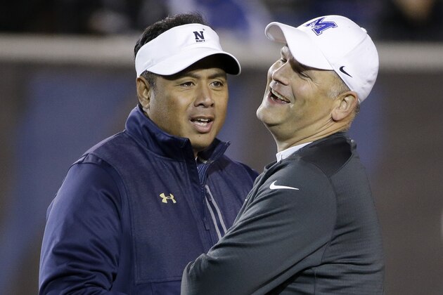 Navy head coach Ken Niumatalolo, left, talks with Memphis head coach Justin Fuente before the start of an NCAA college football game Saturday, Nov. 7, 2015, in Memphis, Tenn. (AP Photo/Mark Humphrey)