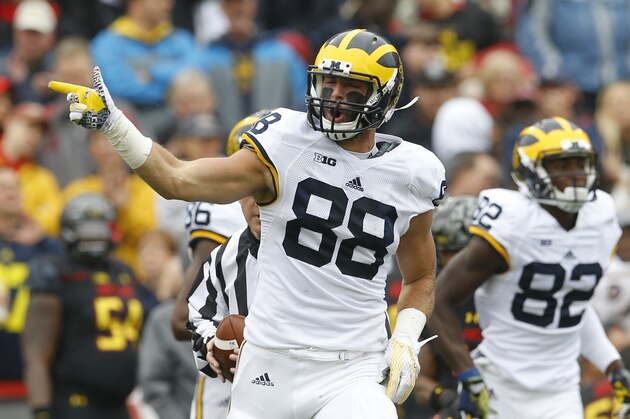 Michigan tight end Jake Butt gestures after rushing for a first down in the first half of an NCAA college football game against Maryland, Saturday, Oct. 3, 2015, in College Park, Md. (AP Photo/Patrick Semansky)