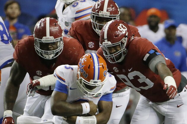 Florida quarterback Treon Harris (3) awaits being sacked by Alabama defensive lineman Jonathan Allen (93) and Alabama defensive lineman A'Shawn Robinson (86) during the first half of the Southeastern Conference championship NCAA college football game, Saturday, Dec. 5, 2015, in Atlanta. (AP Photo/David Goldman)