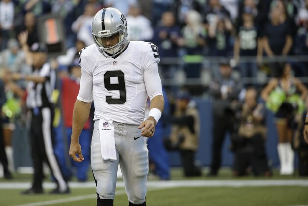 Oakland Raiders quarterback Christian Ponder walks after a play in the first half of a preseason NFL football game against the Seattle Seahawks, Thursday, Sept. 3, 2015, in Seattle. (AP Photo/Elaine Thompson)