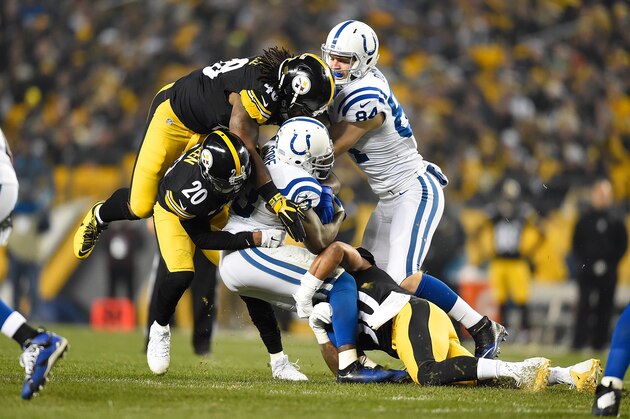 PITTSBURGH, PA - DECEMBER 6:  Frank Gore #23 of the Indianapolis Colts is tackled by Will Allen #20 of the Pittsburgh Steelers and Bud Dupree #48 of the Pittsburgh Steelers during the first quarter of the game at Heinz Field on December 6, 2015 in Pittsburgh, Pennsylvania. (Photo by Joe Sargent/Getty Images)