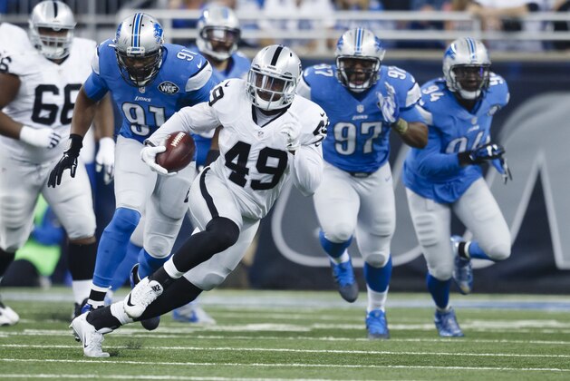 Oakland Raiders running back Jamize Olawale (49) rushes against the Detroit Lions during an NFL football game at Ford Field in Detroit, Sunday, Nov. 22, 2015. (AP Photo/Rick Osentoski)