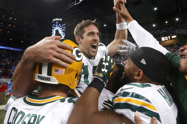 Green Bay Packers quarterback Aaron Rodgers celebrates after his Hail Mary 61-yard touchdown throw to tight end Richard Rodgers with no time remaining in an NFL football game against the Detroit Lions, Thursday, Dec. 3, 2015, in Detroit. Green Bay won 27-23. (AP Photo/Paul Sancya)
