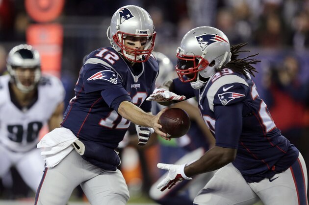 New England Patriots quarterback Tom Brady (12) hands off to running back LeGarrette Blount (29) during the first half of an NFL football game against the Philadelphia Eagles, Sunday, Dec. 6, 2015, in Foxborough, Mass. (AP Photo/Charles Krupa)