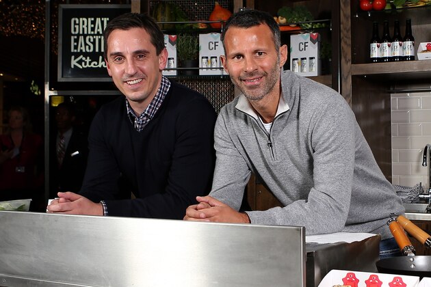 LONDON, ENGLAND - NOVEMBER 20:   Gary Neville and Ryan Giggs pose during a Cook Off at Westfield Stratford City on November 20, 2013 in London, England. Former teammates Gary Neville and Ryan Giggs swapped the pitch for pans when they took part in a cook-off ahead of opening their new restaurant, Cafe Football. (Photo by Jan Kruger/Getty Images)