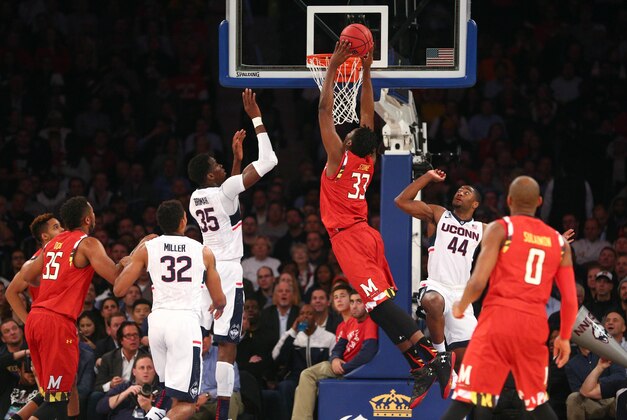Dec 8, 2015; New York, NY, USA; Maryland Terrapins center Diamond Stone (33) dunks over Connecticut Huskies center Amida Brimah (35) during the first half of the second game of the Jimmy V Classic at Madison Square Garden. Mandatory Credit: Brad Penner-USA TODAY Sports
