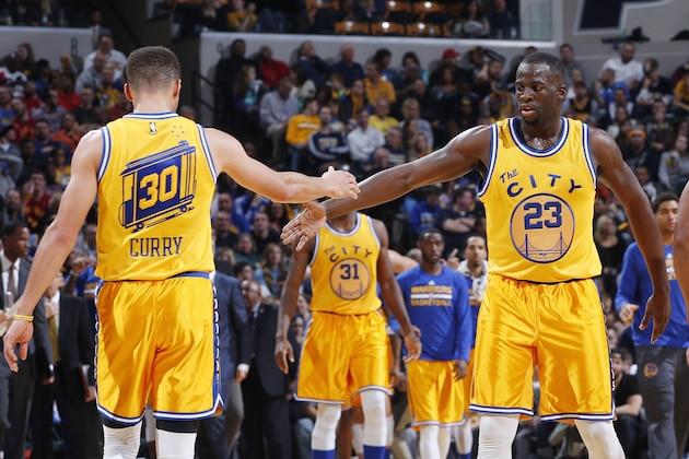 INDIANAPOLIS, IN - DECEMBER 8: Draymond Green #23 and Stephen Curry #30 of the Golden State Warriors celebrate against the Indiana Pacers in the second half of the game at Bankers Life Fieldhouse on December 8, 2015 in Indianapolis, Indiana. The Warriors defeated the Pacers 131-123 to move to 23-0 on the season. NOTE TO USER: User expressly acknowledges and agrees that, by downloading and or using the photograph, User is consenting to the terms and conditions of the Getty Images License Agreement. (Photo by Joe Robbins/Getty Images)