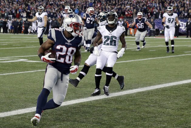 New England Patriots running back James White (28) scores a touchdown in front of Philadelphia Eagles safety Walter Thurmond (26) after catching a pass from Tom Brady during the first half of an NFL football game, Sunday, Dec. 6, 2015, in Foxborough, Mass. (AP Photo/Charles Krupa) New England Patriots running back James White (28) scores a touchdown in front of Philadelphia Eagles safety Walter Thurmond (26) after catching a pass from Tom Brady during the first half of an NFL football game, Sunday, Dec. 6, 2015, in Foxborough, Mass. (AP Photo/Charles Krupa)